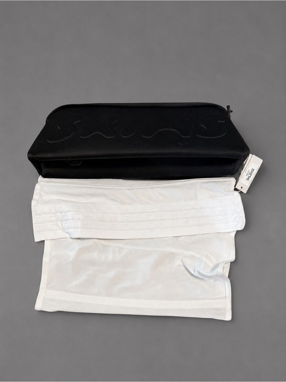 Skims white waist trainer with bag